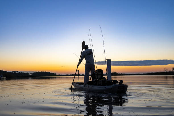 istock Stand-Up Kayaker at Dawn 1456051091