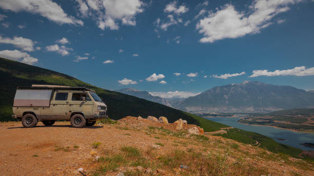 istock Adventure oldtimer van or camper, campervan on high plain with g 1456054311