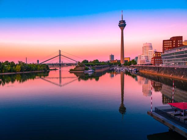 istock Skyline of Dusseldorf harbor at dusk reflected in the water 1456057722