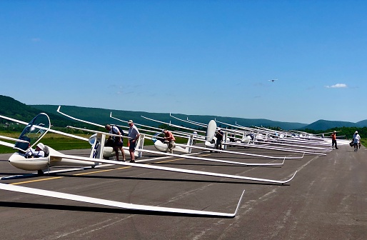 Sailplanes on the Runway - 5/27/21: A color photograph of a sailplanes on the runway and in the grid ready for takeoff in Pennsylvania.