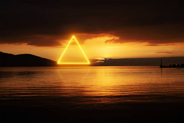 stunning triangle shape made with neon light on the sunset landscape skyline