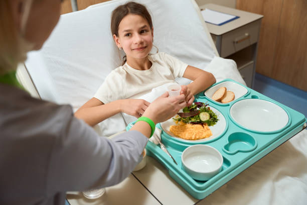 istock Doctor giving medicine to patient while eating 1456058661