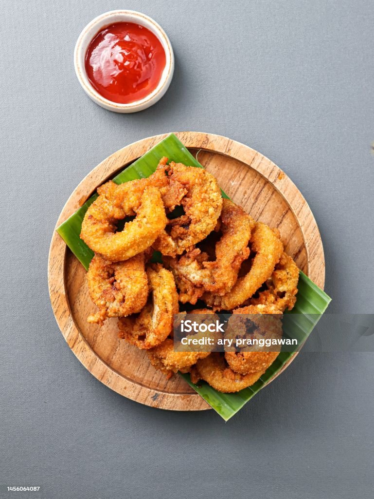 Fried Squid Or Calamari With Curry Seasoning Stock Photo - Download