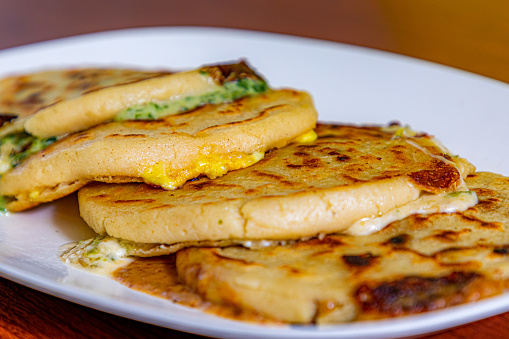 Traditional Turkish pancake gozleme in the plate on the restaurant table, Turkish baked bread