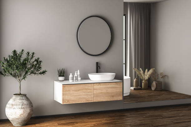 istock Modern bathroom interior with dark brown parquet floor, white oval bathtub and two sinks, front view. Minimalist bathroom with modern furniture and city view. 3D rendering 1456069338