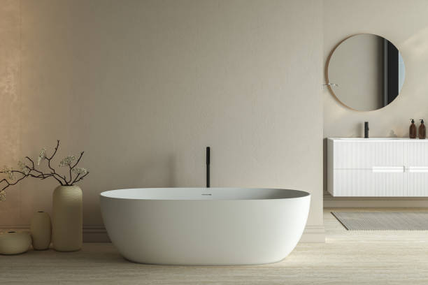 istock Bright minimal bathroom interior with white basin and oval mirror, bathtub, dry plants in vase, carpet on granite floor. Bathing accessories and window in hotel studio. 3D rendering 1456070272