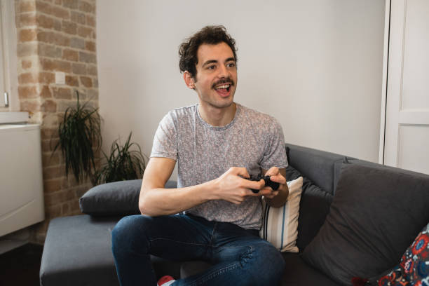 istock Portrait of a young man having fun playing video games 1456070596