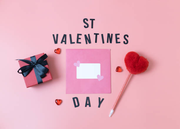 istock Envelope, gift box and heart pen on a pink background. 1456071571