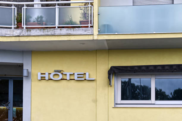 istock old style neon sign with word hotel on a yellow wall 1456077711
