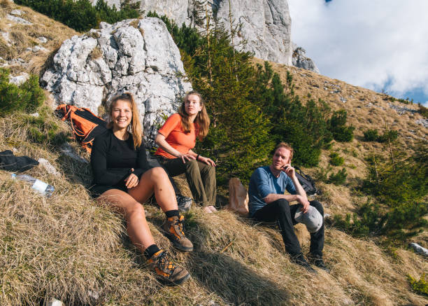 istock Hiking friends relax on mountain ridge 1456078983
