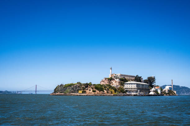 Alcatraz Island with the Golden Gate Bridge in the Distance. stock photo