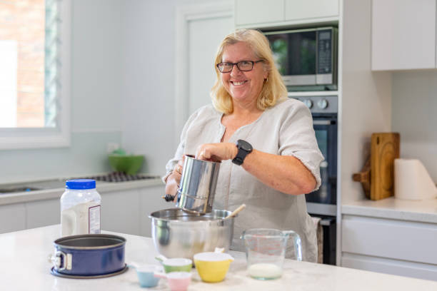 istock Happy Mature Woman Cooking in Her Kitchen 1456081296