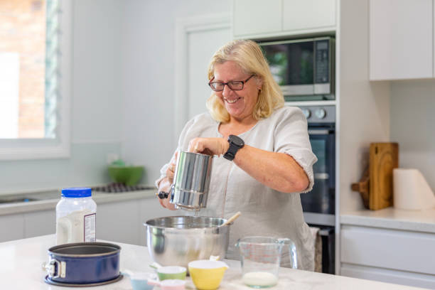 istock Happy Mature Woman Cooking in Her Kitchen 1456081304