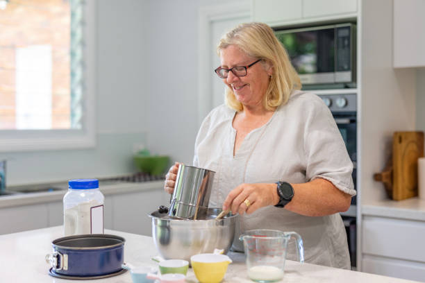 istock Happy Mature Woman Cooking in Her Kitchen 1456081307