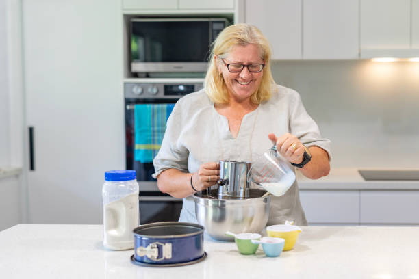 istock Happy Mature Woman Cooking in Her Kitchen 1456081310