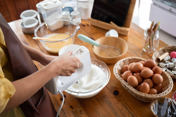 istock A woman's hand is using an electric beater to whip whipped cream. 1456084980