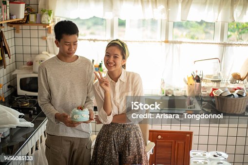 istock A woman and a man are happy to finish the cake. 1456085133