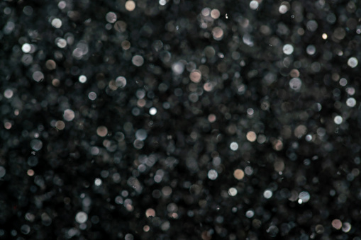 Glitter grain ornament on black background