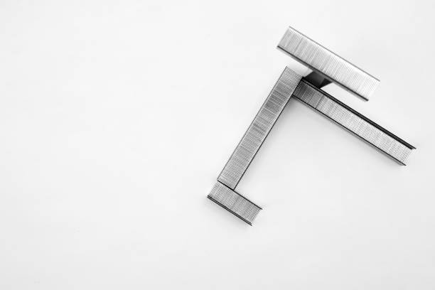 Metal staples for industrial and office stapler close-up on a white background