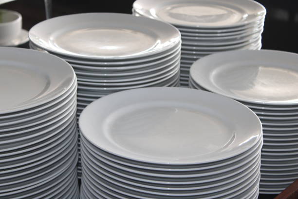 istock pile of white plates 1456089854