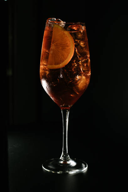 istock Vertical shot of a cocktail isolated on a black background 1456098360