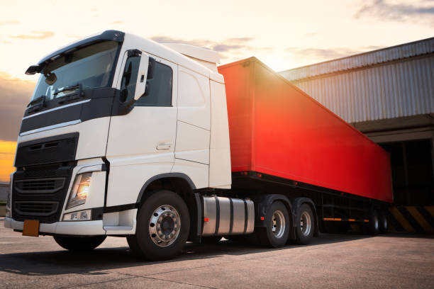 istock Tractor Trucks Engine Diesel. Semi Trailer Trucks Parked Loading at Dock Warehouse. Shipping Cargo Container Delivery. Distribution Warehouse. Freight Trucks Logistics Cargo Transport 1456099810