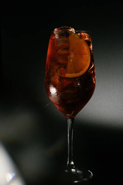 istock Vertical shot of a cocktail isolated on a black background 1456101205