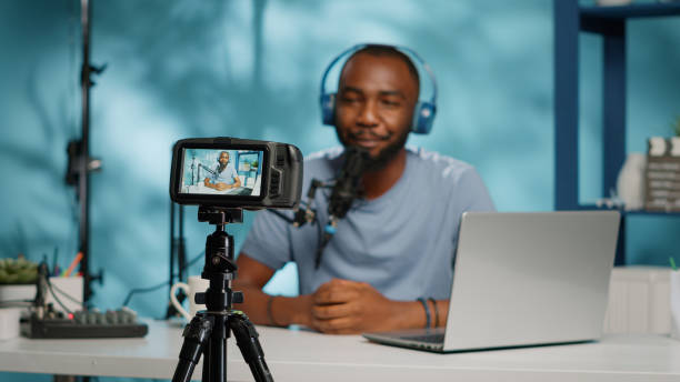 istock Close up of content creator recording video on camera 1456102925
