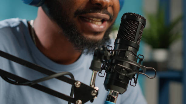 istock Close up of african american vlogger using microphone 1456103322