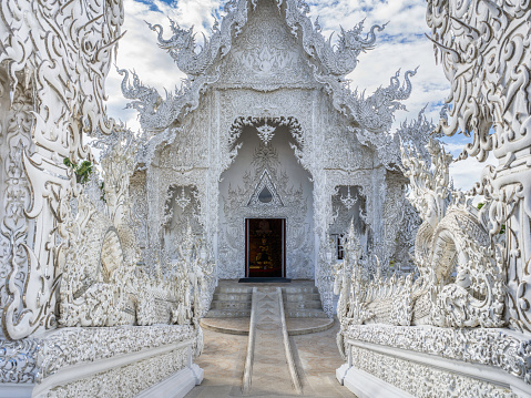 Wat Rong Khun in Chiang Rai Thailand. Entrance into the famous buddhist White Temple in Chiang Rai. Hasselblad X2D 102 MPixel Detail Photo. White Temple - Wat Rong Khun - Chiang Rai, Chiang Mai, Northern Thailand, Southeast Asia