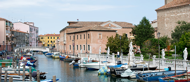 Chioggia - Venice, Italy - August 12, 2018: Canals and bridges of Chioggia. This small town is known as The Little Venice.