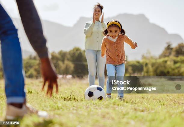 Parents Park And Girl Kick Soccer Ball For Fun Sports Learning Bonding And Relax In Sunshine Garden And Nature Together Happy Family Little Girl And Black People Playing Football On Grass Field Stock Photo - Download Image Now