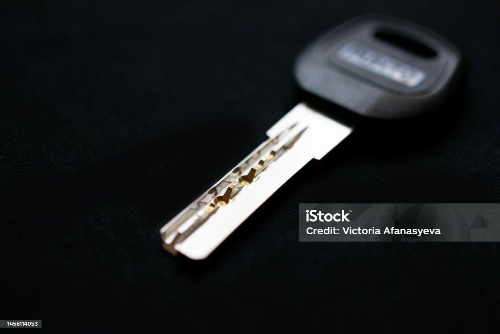 one key to the apartment on a black background.selective focusing one key to the apartment on a black background.selective focusing.place for text Accessibility Stock Photo