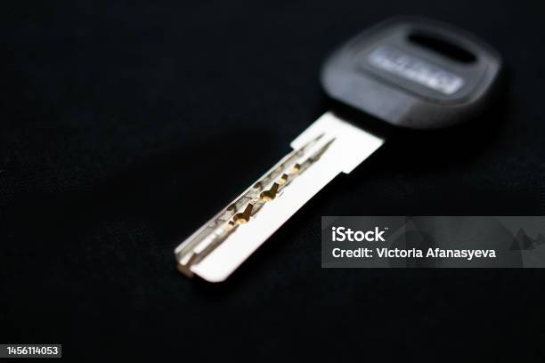 One Key To The Apartment On A Black Backgroundselective Focusing Stock Photo - Download Image Now