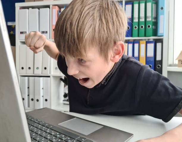 istock Irritated teenager is nervous during computer game 1456114300