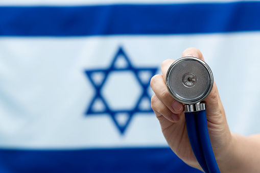 Stethoscope in front of Israeli flag.