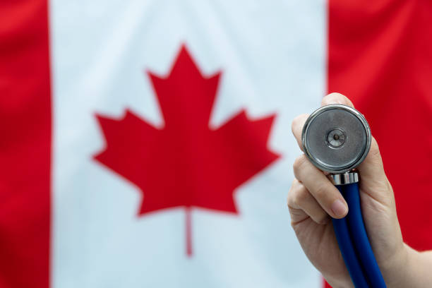 istock Stethoscope in front of Canadian flag 1456117253