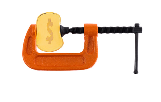 C-clamp bending a dollar coin.