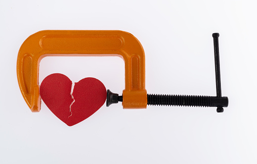 Orange clamp with a broken heart.