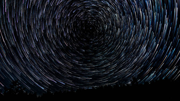 istock Star trails in the night sky 1456118720