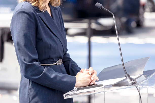 istock Female Speaker At Business Conference, Presentation Or Press Conference 1456123720