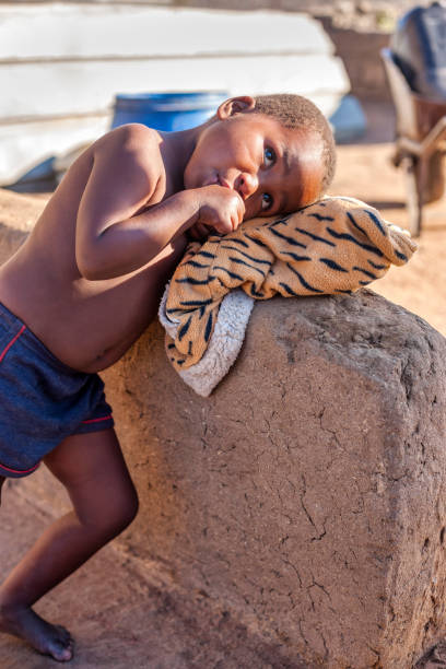 istock village african child playing 1456124201