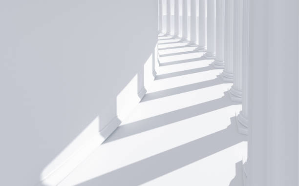 istock Row of white columns projecting shadows on a curved wall: classical architecture with copy space 1456124240