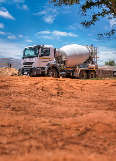 istock concrete mixer truck going on the construction site 1456124266