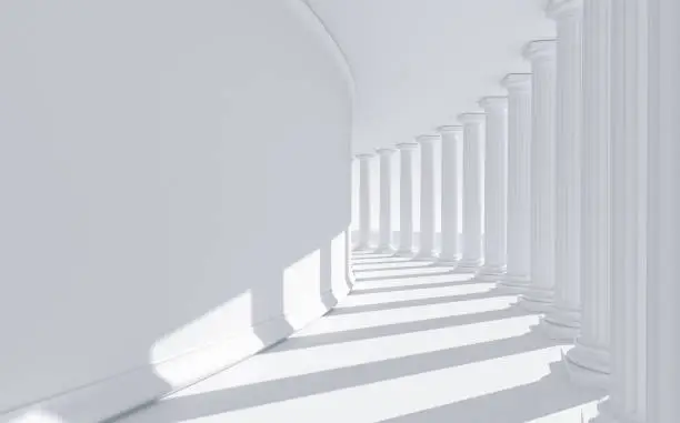 Photo of White columns in a bent row: classical roman and greek architecture with copy space.