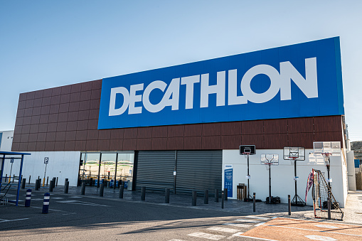 Malaga, Spain – January 23, 2022: The Decathlon building in Malaga, Spain under a clear sky