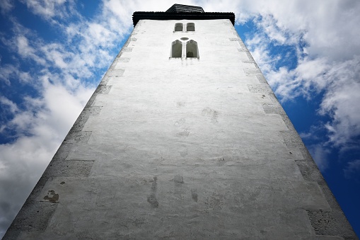 A low-angle shot of the church of Holy Spirit with a cloudy blue sky in the background Zegre, Slovakia