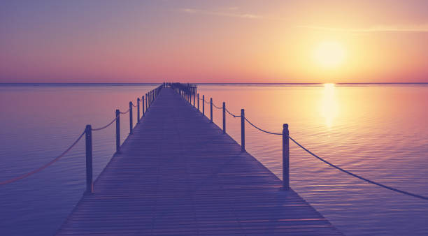 istock Wooden sea pier silhouette at sunset. 1456126520