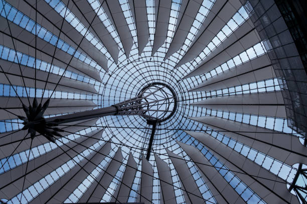 istock Low angle shot of modern glass architecture under blue sky 1456126572