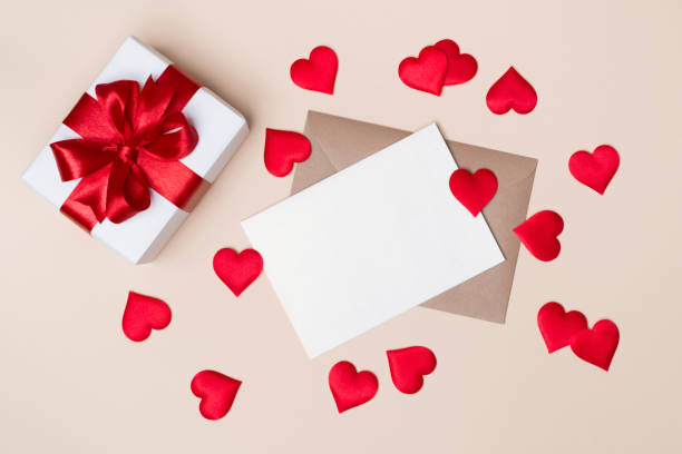 istock Decorated gift box and letter with red ribbon and hearts 1456127318